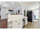 The kitchen offers white countertops and plenty of cabinet space, adjacent to laundry area at 407 Chesterfield Ave, Lancaster, SC 29720
