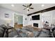 Cozy living room with a modern fireplace, TV, ceiling fan and decorative rug at 407 Chesterfield Ave, Lancaster, SC 29720