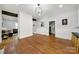 Spacious living room boasts wood floors, and an open layout connecting to other rooms at 407 Chesterfield Ave, Lancaster, SC 29720