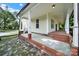Charming side porch features brick accents and classic architectural details at 407 Chesterfield Ave, Lancaster, SC 29720