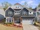 Beautiful two-story home featuring a two-car garage, stone accents, and professionally landscaped front yard at 4412 Foxview Ct, Charlotte, NC 28270