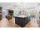 Kitchen island and living room create an inviting open floor plan with lots of natural light at 4412 Foxview Ct, Charlotte, NC 28270