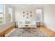 This living room features hardwood floors, a neutral color palette, and a large window with natural light at 4412 Foxview Ct, Charlotte, NC 28270