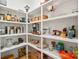 Organized pantry featuring white shelves and ample storage for kitchen essentials and food items at 4412 Foxview Ct, Charlotte, NC 28270