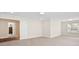 Bright room with neutral carpeting, white walls, and access to hallway, offering versatile space at 4412 Foxview Ct, Charlotte, NC 28270