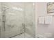 This bathroom features a glass-enclosed shower with marble tiling, a rainfall shower head, and a built-in bench at 4412 Foxview Ct, Charlotte, NC 28270