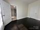Bedroom view with dark wood floors and access to an attached bathroom at 501 E Lafayette St, Salisbury, NC 28144