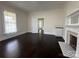 Light-filled living room features hardwood floors and a decorative fireplace at 501 E Lafayette St, Salisbury, NC 28144