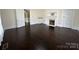 Living room featuring dark hardwood floors and a decorative fireplace at 501 E Lafayette St, Salisbury, NC 28144