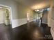 Spacious living room featuring dark wood floors and staircase at 501 E Lafayette St, Salisbury, NC 28144
