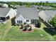 Aerial view of home with backyard patio, landscaping and a lush green lawn at 5039 Folly Ln, Fort Mill, SC 29707