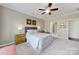 Comfortable bedroom featuring a queen bed, side tables, and soft carpeting at 5039 Folly Ln, Fort Mill, SC 29707