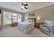 Cozy bedroom with a large window, comfortable bed, and neutral decor at 5039 Folly Ln, Fort Mill, SC 29707