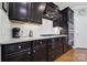 Updated kitchen showcasing granite countertops, sleek dark cabinetry, and stainless steel appliances at 5039 Folly Ln, Fort Mill, SC 29707