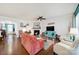 Cozy living room featuring hardwood floors, a fireplace, and comfortable seating at 5039 Folly Ln, Fort Mill, SC 29707