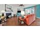 Bright living room with hardwood flooring, fireplace, ceiling fan, and large windows at 5039 Folly Ln, Fort Mill, SC 29707