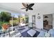 Relaxing sunroom with comfortable seating, screened windows, and a ceiling fan at 5039 Folly Ln, Fort Mill, SC 29707