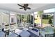 Bright sunroom with multiple windows and seating, offering views of the backyard at 5039 Folly Ln, Fort Mill, SC 29707