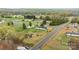 A one-story home with spacious lot in community with lots of green trees and grass at 5110 Old Still Ln, Bessemer City, NC 28016