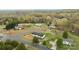 A neighborhood view with tree coverage and one-story homes featuring large yards at 5110 Old Still Ln, Bessemer City, NC 28016