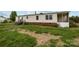 A one-story house has vinyl siding, brick foundation, and a wooden staircase to the porch at 5110 Old Still Ln, Bessemer City, NC 28016