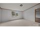 Bedroom featuring neutral carpet, double windows for ample light, and a flush-mount ceiling light at 5110 Old Still Ln, Bessemer City, NC 28016