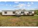 Charming single-story home featuring a well-maintained front yard under a blue and cloudy sky at 5110 Old Still Ln, Bessemer City, NC 28016