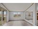 Light-filled living area with sliding glass doors leading to the back deck and an open view to additional living space at 5110 Old Still Ln, Bessemer City, NC 28016