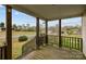 Inviting covered porch with wooden railing, providing a relaxing outdoor space with a view at 5110 Old Still Ln, Bessemer City, NC 28016