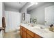 Well-lit bathroom with double sink vanity, large mirror, and shower with curtain at 517 Bertram Rd, Fort Mill, SC 29708
