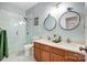 Bright bathroom featuring a double vanity, updated fixtures, and glass shower with white tile at 517 Bertram Rd, Fort Mill, SC 29708