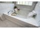 Close up of a soaking tub with relaxing ambiance and decor at 517 Bertram Rd, Fort Mill, SC 29708