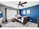 Comfortable bedroom featuring a ceiling fan, neutral walls, and a cozy bed with stylish bedding at 517 Bertram Rd, Fort Mill, SC 29708