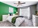 Bright bedroom features white bedding, a ceiling fan, and an area rug at 517 Bertram Rd, Fort Mill, SC 29708