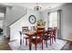 Dining room features wood table with chairs, pendant lighting, staircase and hardwood flooring at 517 Bertram Rd, Fort Mill, SC 29708