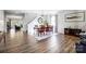 Spacious dining room features wood table with chairs, staircase and hardwood flooring at 517 Bertram Rd, Fort Mill, SC 29708