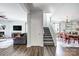 Open-concept entryway showcasing stairs to the second level, and views into the living and dining rooms at 517 Bertram Rd, Fort Mill, SC 29708