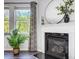 Close-up of a fireplace with a white mantel, a decorative mirror, and stylish decor accents at 517 Bertram Rd, Fort Mill, SC 29708