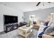 Cozy living room features a comfortable couch, television, and a window for natural light at 517 Bertram Rd, Fort Mill, SC 29708