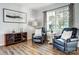 Cozy living room with leather armchairs, hardwood floors, and a large window offering natural light at 517 Bertram Rd, Fort Mill, SC 29708