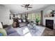 Bright and airy living room featuring hardwood floors, large windows, and a cozy seating area at 517 Bertram Rd, Fort Mill, SC 29708