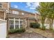 Back exterior view of a brick house with a fenced yard at 5216 Berkeley View Cir, Charlotte, NC 28277