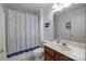 Bright bathroom featuring a single vanity, toilet, and shower with modern decor at 5216 Berkeley View Cir, Charlotte, NC 28277