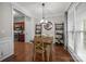 Bright dining room with wood floors and large window at 5216 Berkeley View Cir, Charlotte, NC 28277