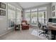 Bright sunroom with many windows, chair, and desk at 5216 Berkeley View Cir, Charlotte, NC 28277