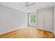 Bright bedroom with wood floors, a ceiling fan and a window with views to the outdoors at 5416 Woodcreek Dr, Charlotte, NC 28226