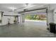 Open garage with ample storage space and views of the landscaped backyard at 5416 Woodcreek Dr, Charlotte, NC 28226
