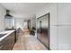 Kitchen includes stainless appliances, modern cabinets, and a view to breakfast nook at 5416 Woodcreek Dr, Charlotte, NC 28226