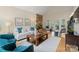 Spacious living room with stone fireplace, vaulted ceilings, and ample natural light at 5416 Woodcreek Dr, Charlotte, NC 28226