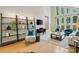 Bright living area with high ceilings, hardwood floors, and comfortable seating at 5416 Woodcreek Dr, Charlotte, NC 28226